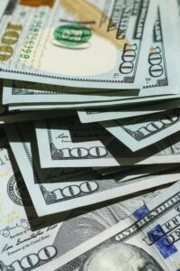 A stack of $100 bills, Why earn more money